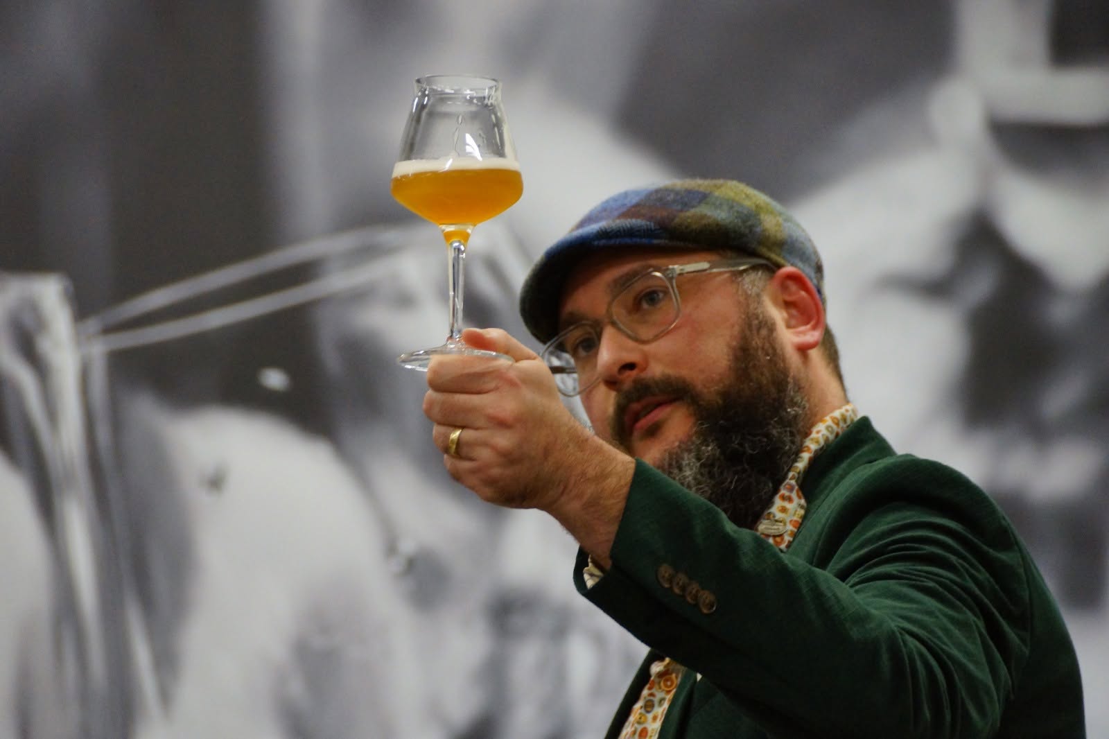 Dennis Kort carefully examining a glass of beer